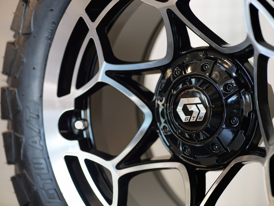 14" Nexus Gloss Black/Silver with 22" Timberwolf A/T (SET OF 4)